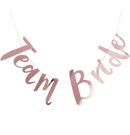 Decorate the bachelorette party with this fun metallic banner! It's a great inexpensive way to add additional fun and "pop" to your party! The 5ft banner says Team Bride in a pretty rose gold. 