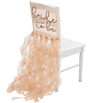Our delicate rose gold glitter BRIDE TO BE organza chair cover is the perfect gift. The sheer white organza chair cover will have the bride be the center of attention.
