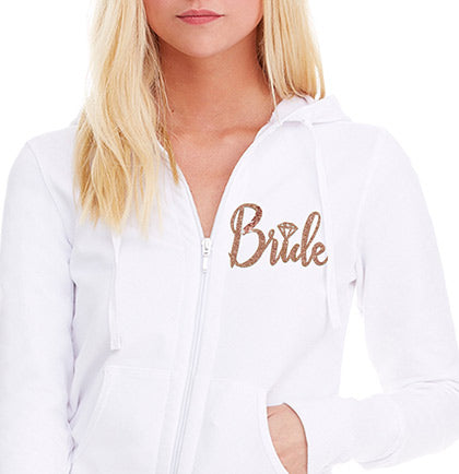 This 95% cotton and 5% spandex french terry hoodie has a glitter graphic on the front that says Bride in a pretty rose gold.