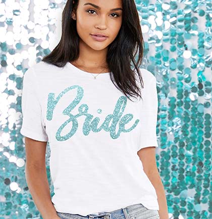 White jersey crew neck tshirt with an aqua glitter Bride graphic on the front.
