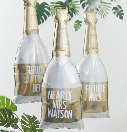 This large 42" gold and white champagne bottle shaped balloon is completely customizable! Customize it to your liking with the provided stickers for the bride. 