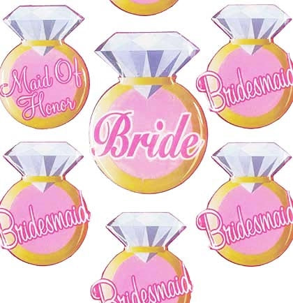This set of 7 bridal party pins is a sweet accessory for the wedding party. Have them wear these party buttons to the rehearsal dinner or bridal shower identifying who they are. The ring shaped button set includes 1 "Bride" button, 5 "Bridesmaid" buttons and 1 "Maid of Honor" button.