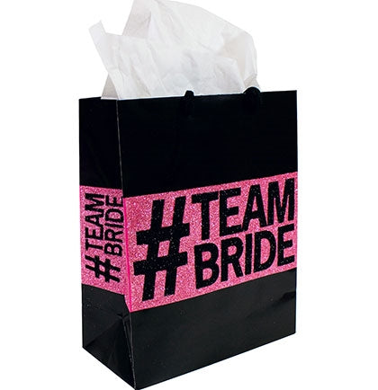 This fun and trendy paper gift bag is perfect to create goodie bags for the bridal party at the bachelorette party. The medium sized bag says #TEAM BRIDE in a glossy black and pink glitter. 