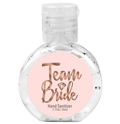 This pink and rose gold sanitizing gel says TEAM BRIDE in a pretty font. This inexpensive 62% alcohol hand sanitizer is the perfect sized party favor to include in a bridesmaid or bachelorette party survival kit!