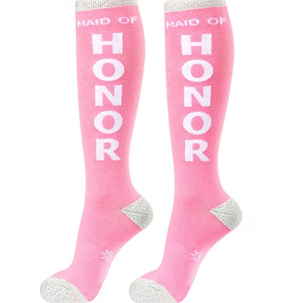These fun knee-high bachelorette party socks are perfect for the maid of honor! The socks say MAID OF HONOR in white lettering with metallic silver trim. 