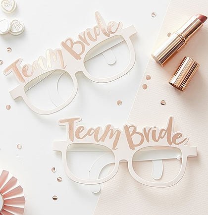 Get ready for some adorable party pics in these Team Bride glasses! This set of 8 cardstock glasses say "Team Bride" in a metallic Rose Gold Font! 