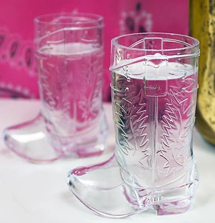 This adorable plastic Western Boot Shaped shot glass holds 1.5oz of liquid and are perfect to celebrate the bride! T