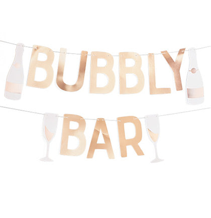 Let everyone know it&#39;s going to be a party! This banner says BUBBLY BAR and is accented with two champagne bottles and glasses! Place it on a wall behind a party table or place it in front of a table to indicate where you&#39;re bar is located.
