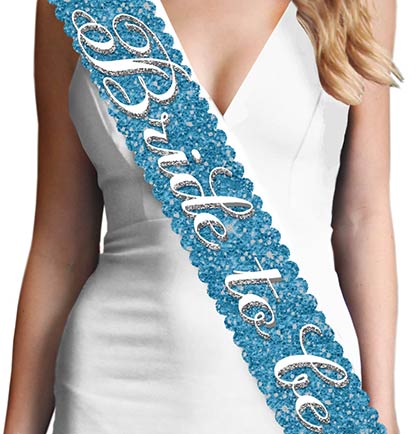 This gorgeous scalloped edge turquoise sparkle sash says &quot;Bride to Be&quot; in a pretty white and silver gray flirty font. This sash is beautiful, it won&#39;t shed sparkle and has a satin backside for a comfy fit.  Plus, this Bride to Be sash matches our other turquoise sparkle sashes: Maid of Honor, Bridesmaid &amp;  Brides Entourage available for purchase separately!