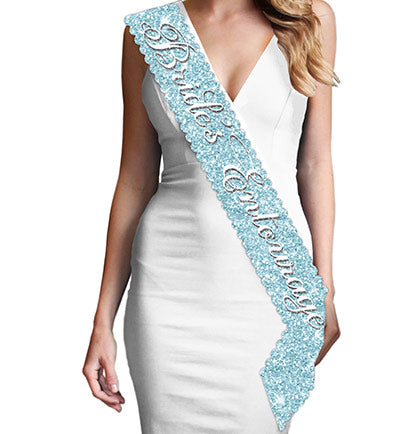 The beautiful ice blue sash says "Bride's Entourage" in white and silver gray flirty font. This sparkle sash won't shed and fits comfortably with a smooth satin backside. Plus, this Bride's Entourage sash matches the other ice blue Bridal Shower sashes: Maid of Honor, Bridesmaid and Bride to Be, available for purchase separately!