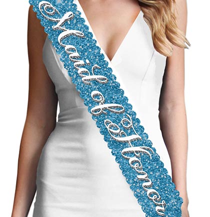 Gift the main girl this gorgeous scalloped edge turquoise sparkle sash! The sash says "Maid of Honor" in a pretty white and silver gray flirty font. This sash is beautiful, it won't shed sparkle and has a satin backside for a comfy fit.  Plus, this Maid of Honor sash matches our other turquoise sparkle sashes: Bride to Be, Bridesmaid &  Brides Entourage available for purchase separately!